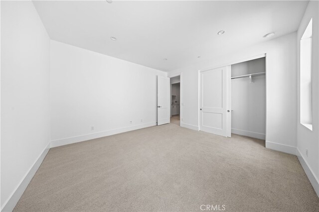 312 Brimwood, Irvine, CA 92618 - unfurnished bedroom with light colored carpet and a closet