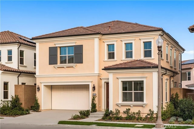 312 Brimwood, Irvine, CA 92618 - view of front of house featuring an attached garage, a tile roof, stucco siding, and concrete driveway