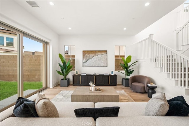 312 Brimwood, Irvine, CA 92618 - living room featuring wood finished floors, recessed lighting, and stairs
