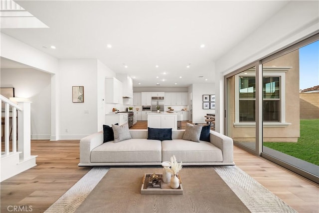 312 Brimwood, Irvine, CA 92618 - living room featuring light wood-style floors, stairway, and recessed lighting