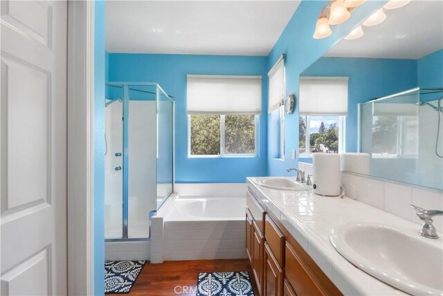 9044 Sylmar Ave, Panorama City, CA 91402 - full bath with a shower stall, a garden tub, double vanity, and wood finished floors