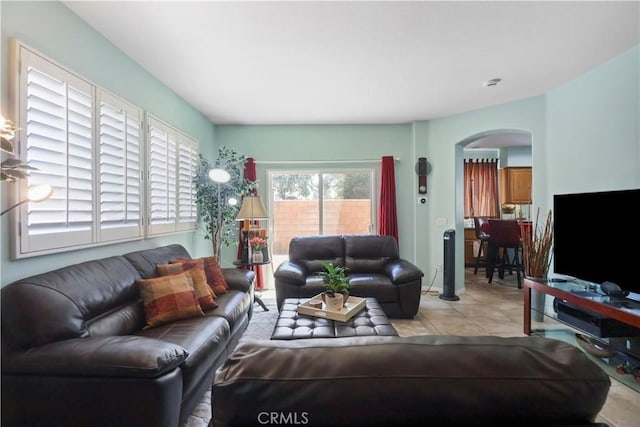 9044 Sylmar Ave, Panorama City, CA 91402 - living area with arched walkways and tile patterned flooring