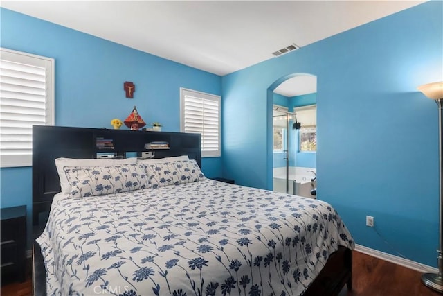 9044 Sylmar Ave, Panorama City, CA 91402 - bedroom with arched walkways and wood finished floors