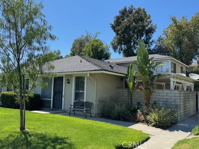 1353 E Fairgrove Ave Unit 293, West Covina, CA 91792 - ranch-style house with a front yard, stucco siding, and a shingled roof