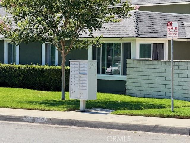 1353 E Fairgrove Ave Unit 293, West Covina, CA 91792 - view of community with mail area and a lawn