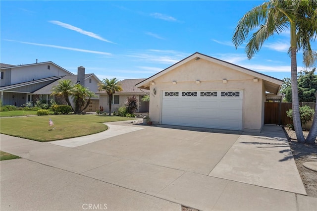 3186 N Hartman St, Orange, CA 92865 - view of front facade with an attached garage, driveway, and stucco siding