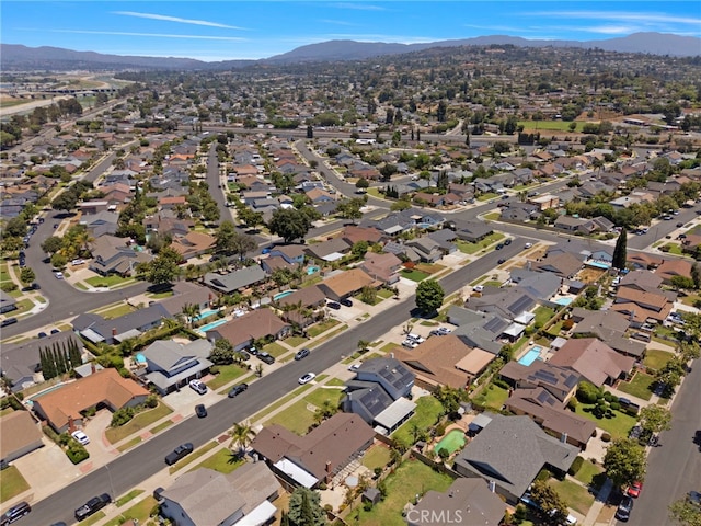 3186 N Hartman St, Orange, CA 92865 - aerial view of property and surrounding area featuring a mountain backdrop and nearby suburban area