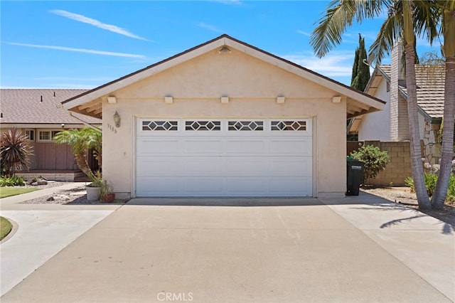 3186 N Hartman St, Orange, CA 92865 - view of front of home with stucco siding, concrete driveway, and an attached garage
