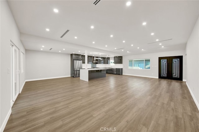 14625 Runnymede St, Van Nuys, CA 91405 - unfurnished living room with recessed lighting and light wood finished floors