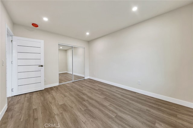 14625 Runnymede St, Van Nuys, CA 91405 - unfurnished bedroom with wood finished floors, recessed lighting, and a closet