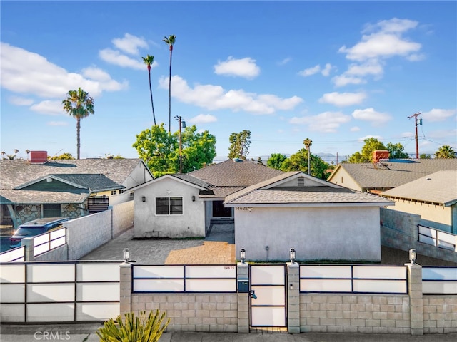 14625 Runnymede St, Van Nuys, CA 91405 - view of front of home featuring a fenced front yard, a gate, stucco siding, and roof with shingles