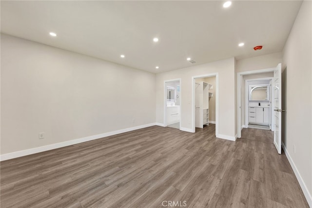 14625 Runnymede St, Van Nuys, CA 91405 - unfurnished bedroom featuring a walk in closet, recessed lighting, wood finished floors, and a closet