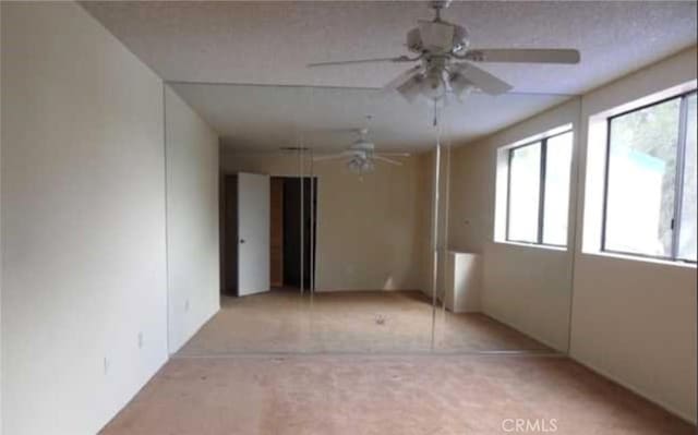 44460 15th St E Unit 3, Lancaster, CA 93535 - carpeted spare room with plenty of natural light and ceiling fan