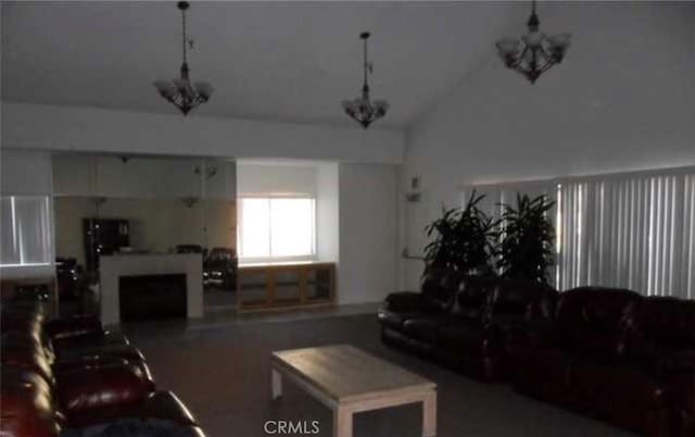 44460 15th St E Unit 3, Lancaster, CA 93535 - living room featuring a chandelier and high vaulted ceiling