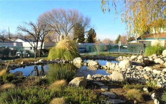 44460 15th St E Unit 3, Lancaster, CA 93535 - view of pool featuring a small pond