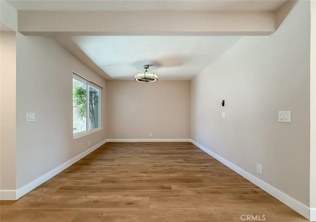 19237 Index St Unit 5, Porter Ranch, CA 91326 - empty room with wood finished floors and baseboards