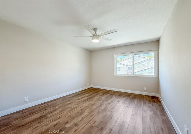 19237 Index St Unit 5, Porter Ranch, CA 91326 - empty room with wood finished floors and a ceiling fan