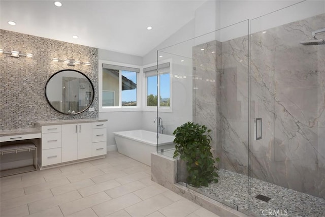 27705 Homestead Rd, Laguna Niguel, CA 92677 - bathroom featuring a freestanding bath, lofted ceiling, a marble finish shower, vanity, and recessed lighting
