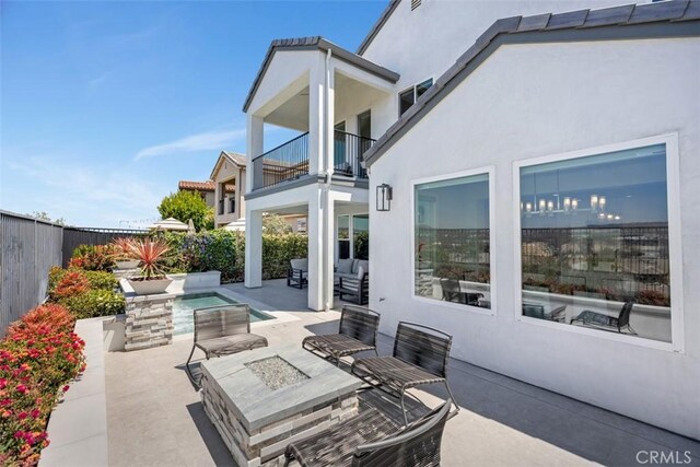27705 Homestead Rd, Laguna Niguel, CA 92677 - patio / terrace featuring a patio area, a fenced backyard, and an outdoor living space with a fire pit