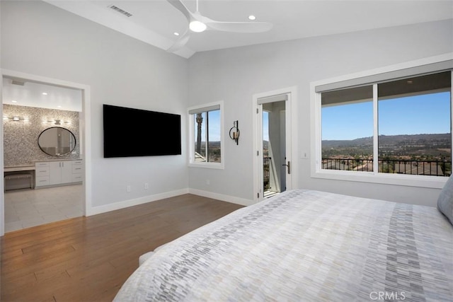 27705 Homestead Rd, Laguna Niguel, CA 92677 - bedroom with multiple windows, lofted ceiling, wood finished floors, ensuite bathroom, and recessed lighting