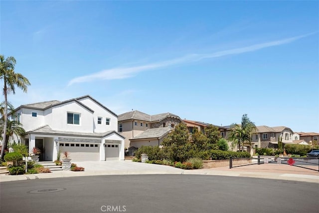 27705 Homestead Rd, Laguna Niguel, CA 92677 - view of front of home featuring a garage, a residential view, concrete driveway, and stucco siding