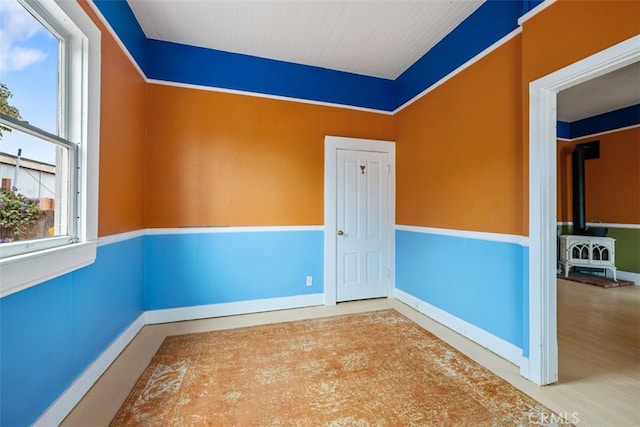 1780 Paso Robles St, Oceano, CA 93445 - empty room featuring baseboards and a wood stove