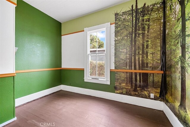 1780 Paso Robles St, Oceano, CA 93445 - empty room featuring wood-type flooring and plenty of natural light