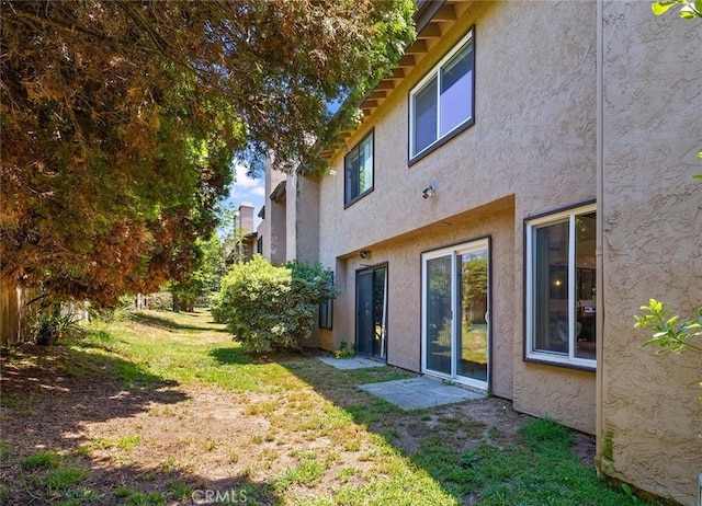 140 E El Norte Pkwy Unit 8, Escondido, CA 92026 - back of property with stucco siding and a yard