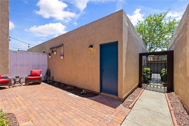 140 E El Norte Pkwy Unit 8, Escondido, CA 92026 - view of patio featuring a gate