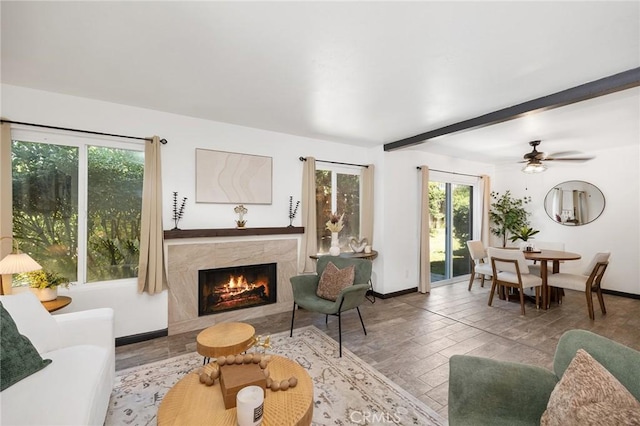 140 E El Norte Pkwy Unit 8, Escondido, CA 92026 - living room with a high end fireplace, wood finished floors, beamed ceiling, and a ceiling fan