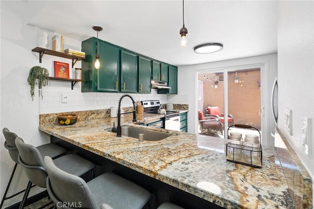 140 E El Norte Pkwy Unit 8, Escondido, CA 92026 - kitchen with green cabinets, stainless steel range with electric cooktop, under cabinet range hood, and tasteful backsplash