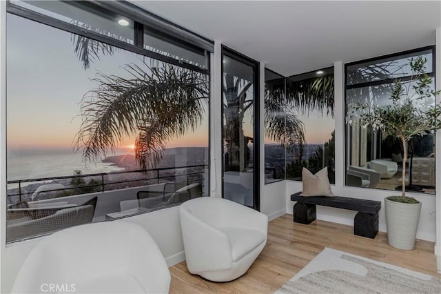 1195 La Mirada St, Laguna Beach, CA 92651 - sitting room with a wall of windows, wood finished floors, and a water view