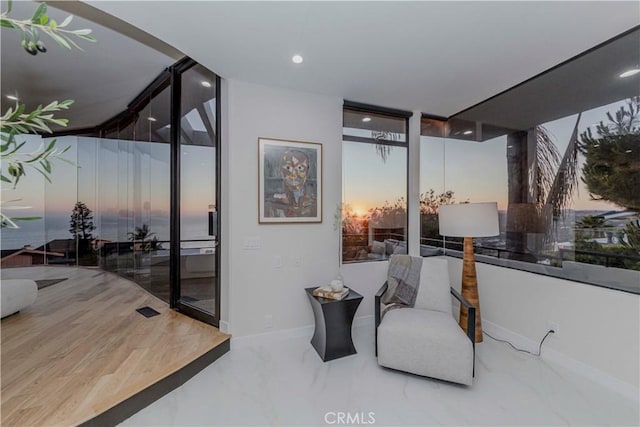 1195 La Mirada St, Laguna Beach, CA 92651 - sitting room with expansive windows, marble tiled floors, and recessed lighting