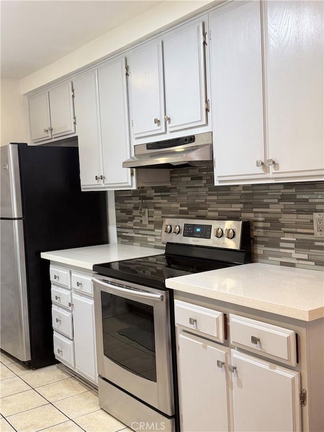 8711 Chessington Dr Unit D, Inglewood, CA 90305 - kitchen with stainless steel appliances, under cabinet range hood, decorative backsplash, and light countertops