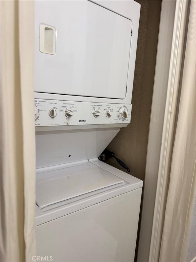 8711 Chessington Dr Unit D, Inglewood, CA 90305 - laundry area with stacked washing machine and dryer