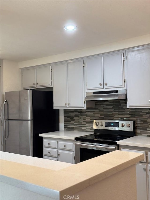 8711 Chessington Dr Unit D, Inglewood, CA 90305 - kitchen featuring appliances with stainless steel finishes, under cabinet range hood, light countertops, decorative backsplash, and recessed lighting