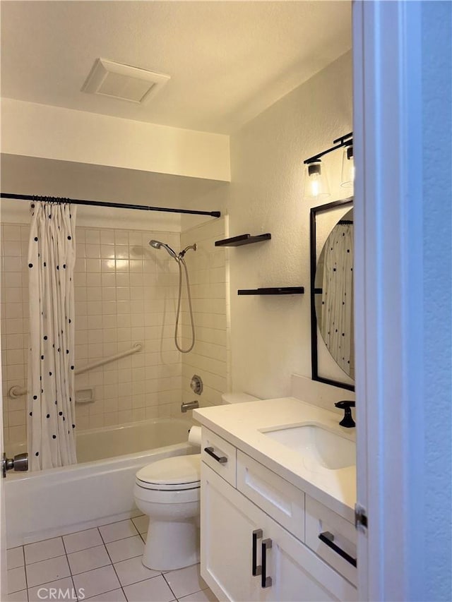 8711 Chessington Dr Unit D, Inglewood, CA 90305 - full bath with tile patterned flooring, shower / bath combo with shower curtain, vanity, and a textured wall