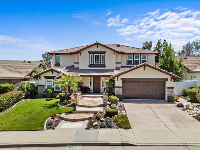 32409 Favara Dr, Temecula, CA 92592 - view of front of house featuring stone siding, stucco siding, covered porch, driveway, and a tile roof