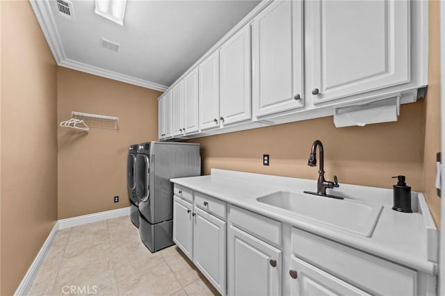 32409 Favara Dr, Temecula, CA 92592 - laundry area featuring cabinet space, washing machine and clothes dryer, crown molding, and light tile patterned floors