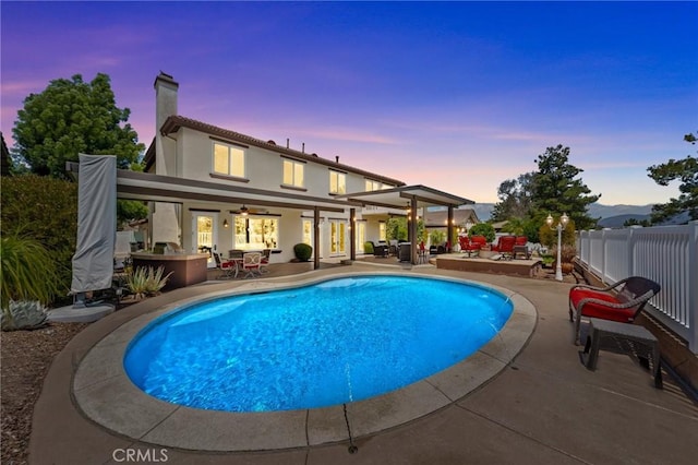 32409 Favara Dr, Temecula, CA 92592 - pool at dusk featuring a patio and ceiling fan