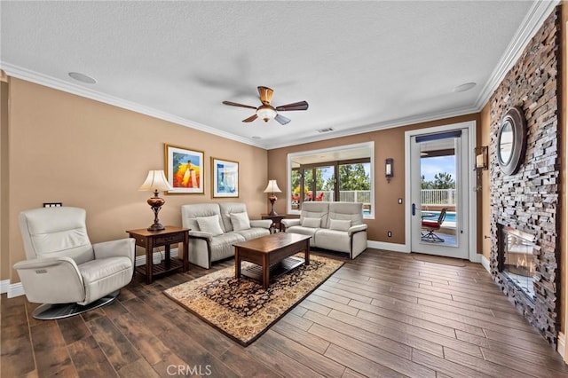 32409 Favara Dr, Temecula, CA 92592 - living room featuring ceiling fan, ornamental molding, dark wood-style floors, and a textured ceiling