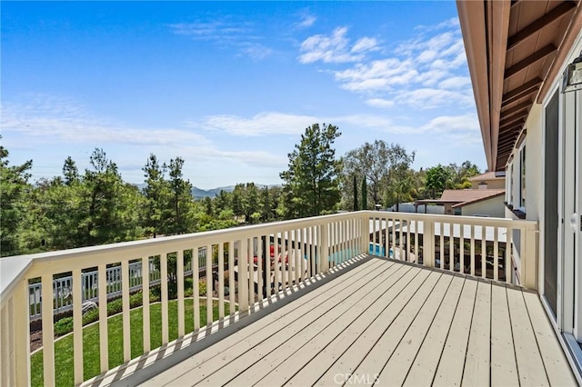 32409 Favara Dr, Temecula, CA 92592 - deck featuring view of wooded area and a lawn