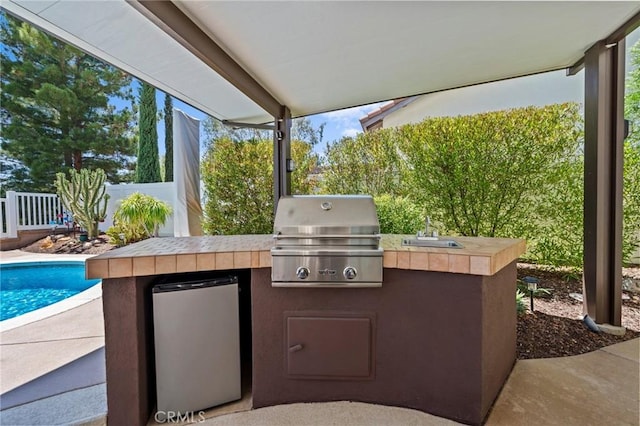 32409 Favara Dr, Temecula, CA 92592 - view of patio / terrace with an outdoor kitchen and a sink