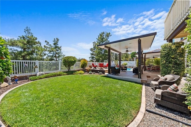 32409 Favara Dr, Temecula, CA 92592 - fenced backyard featuring a ceiling fan, an outdoor hangout area, and a patio area