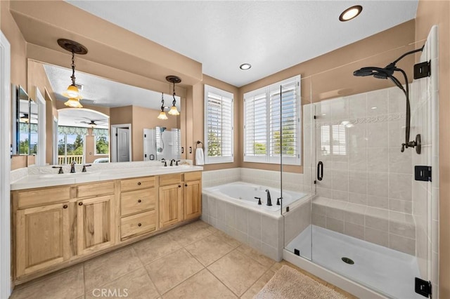 32409 Favara Dr, Temecula, CA 92592 - bathroom featuring a stall shower, a bath, double vanity, healthy amount of natural light, and recessed lighting