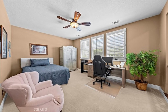 32409 Favara Dr, Temecula, CA 92592 - bedroom with an office area, light colored carpet, and ceiling fan