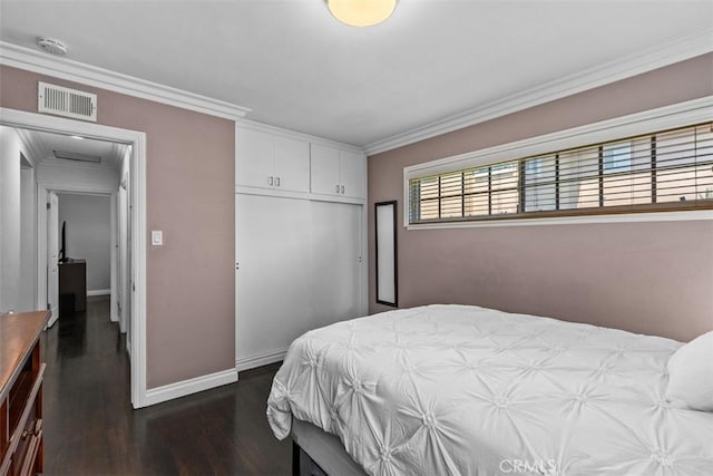 10622 Ashworth St, Bellflower, CA 90706 - bedroom with dark wood finished floors, a closet, ornamental molding, and attic access