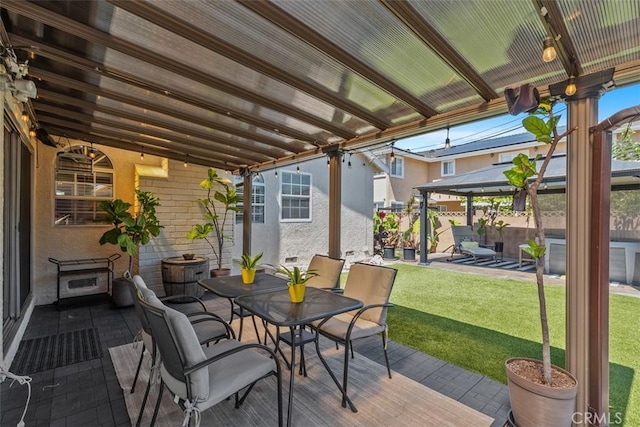 10622 Ashworth St, Bellflower, CA 90706 - wooden terrace featuring a gazebo, a fenced backyard, outdoor dining space, and a patio