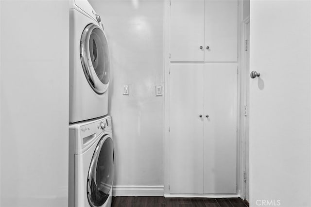 10622 Ashworth St, Bellflower, CA 90706 - washroom featuring stacked washer / dryer and dark wood-style flooring