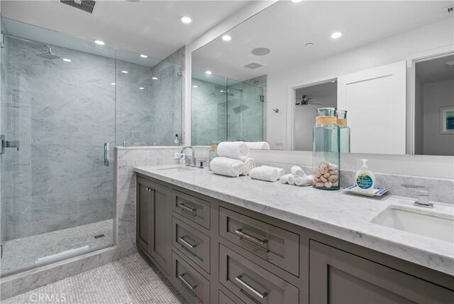 112 30th St, Newport Beach, CA 92663 - bathroom featuring vanity, a marble finish shower, tile patterned floors, and recessed lighting